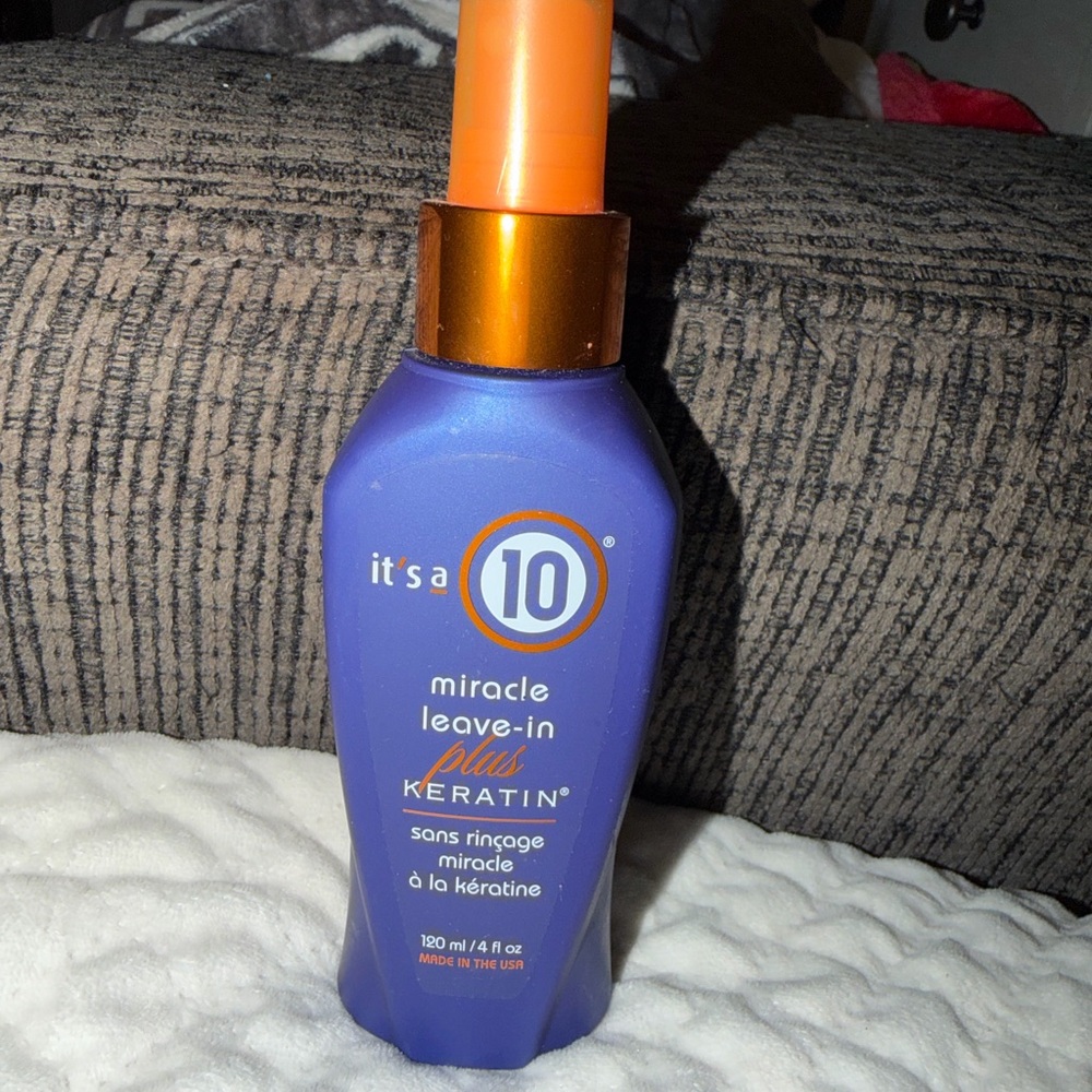 It's a 10 Miracle Leave-In Plus Keratin Spray — Purple & Orange Bottle
